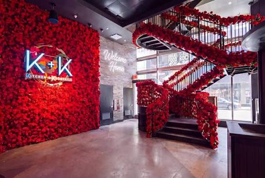 Kitchen + Kocktails NYC, dramatic red floral interior and staircase